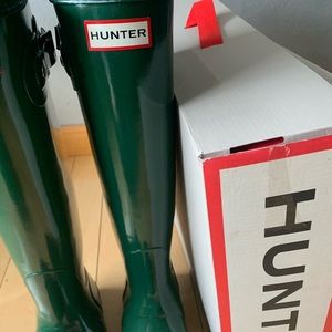 Tall glossy hunter boots